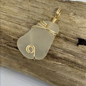 White Sea glass and gold colored wire pendant
